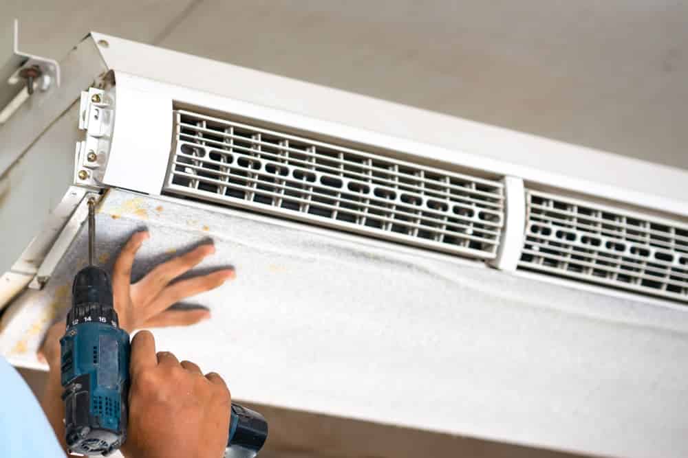 Split type aircon being repaired — Air Conditioning Experts in Raymond Terrace, NSW